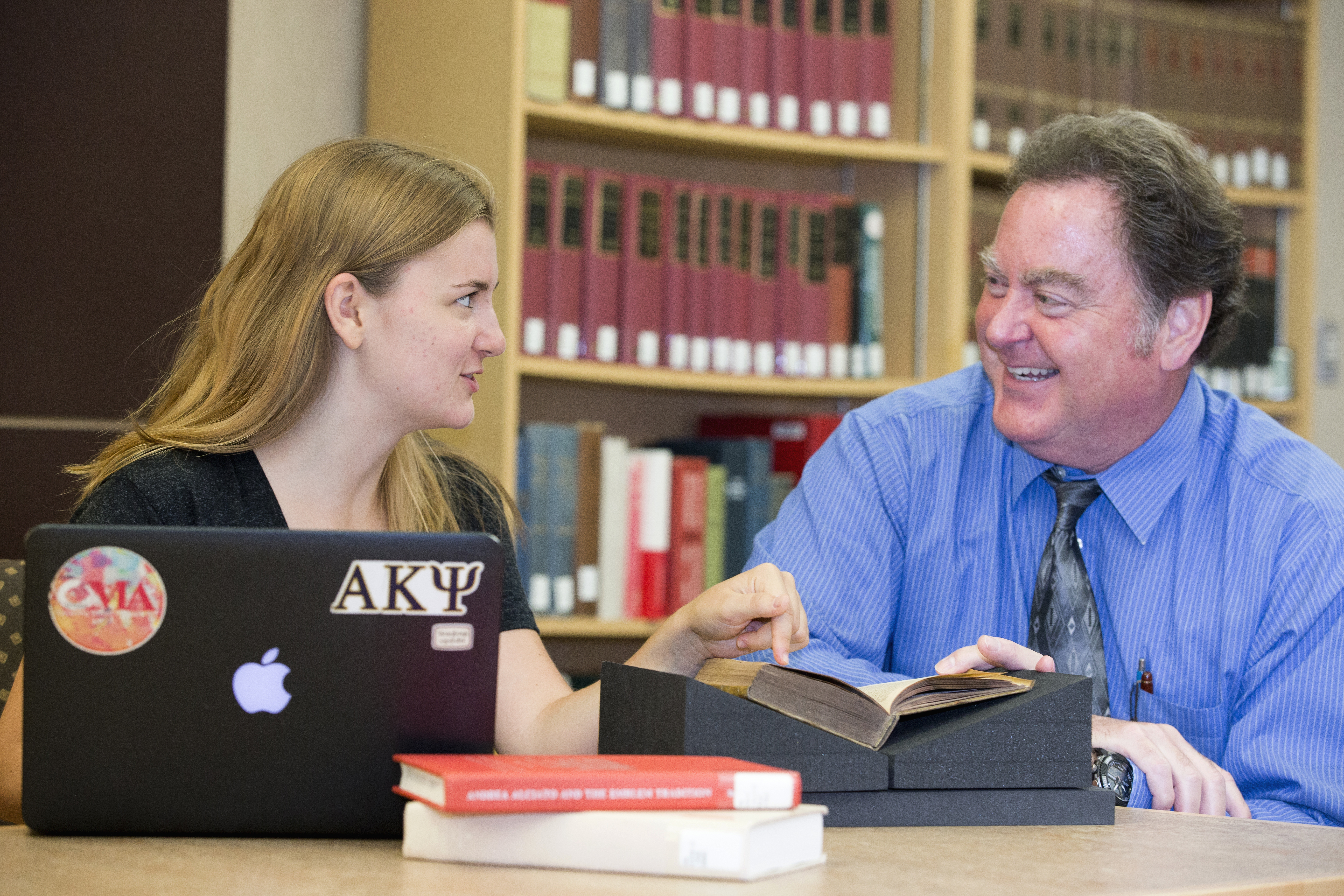 Image of a librarian helping a student